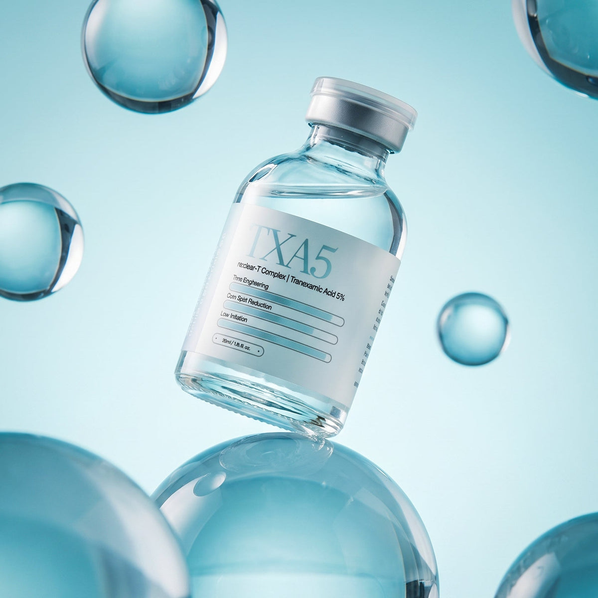 re:tones re:clear-T Brightening Glow ampoule, 50 mL crimp-sealed vial, tranexamic acid 5 percent.