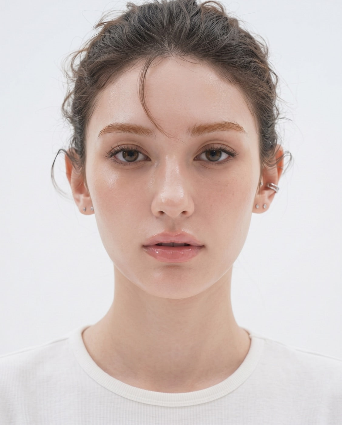 A straight-on studio portrait, hair tied back, used as the base for the depth map: the eye area, forehead, cheeks and jaw are each outlined and tinted.