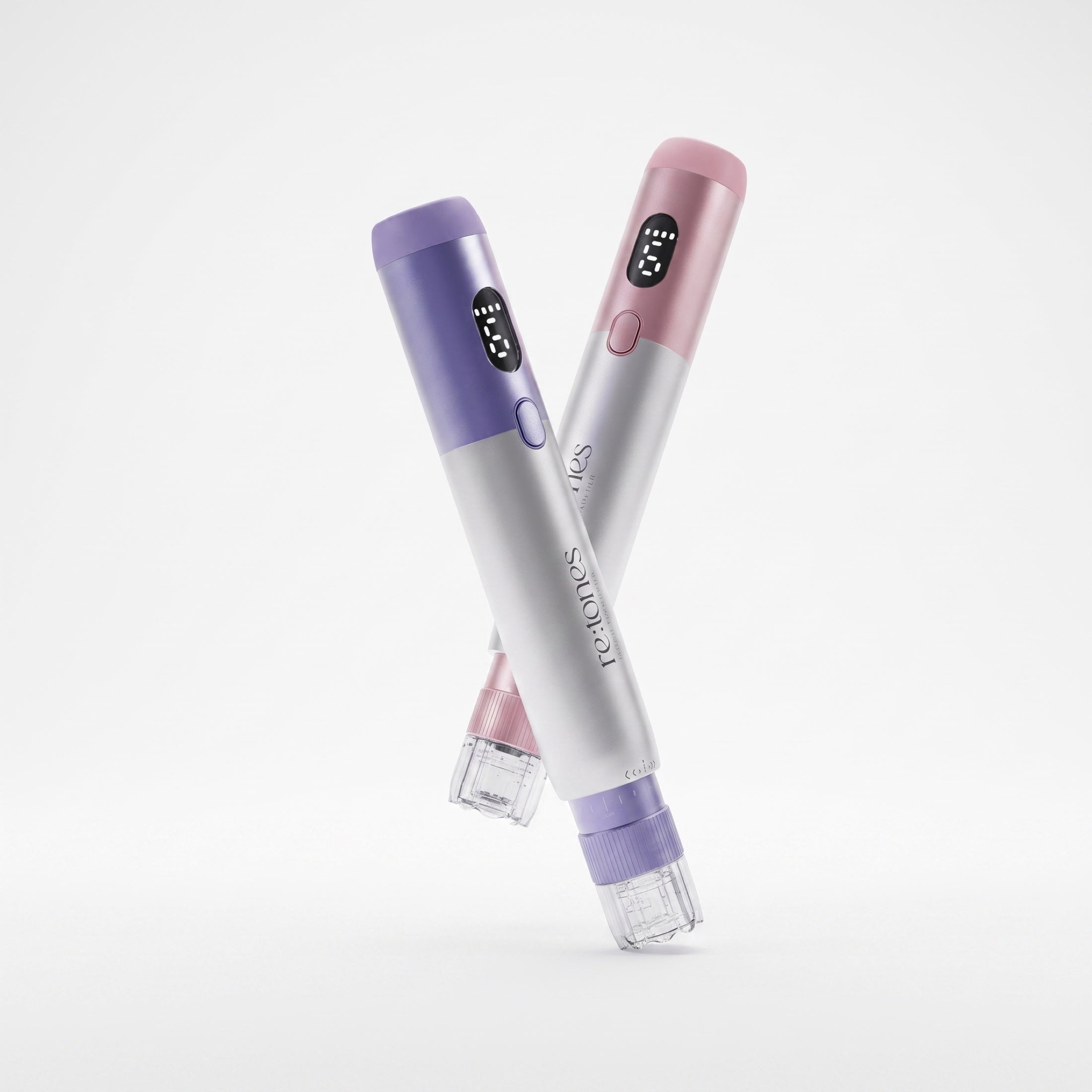 The re:tones Skin Rejuvenation Tap Pen Device in purple and pink, crossed on a pale ground.