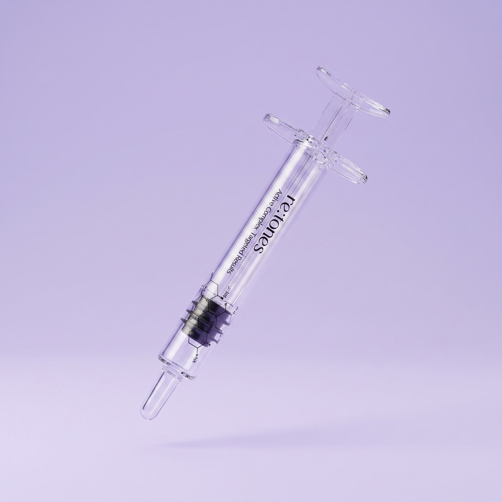The re:tones plastic syringe, which passes through the vial's rubber septum to draw a dose